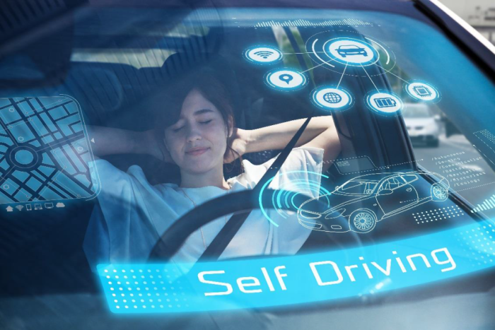 Woman resting in a self driving vehicle